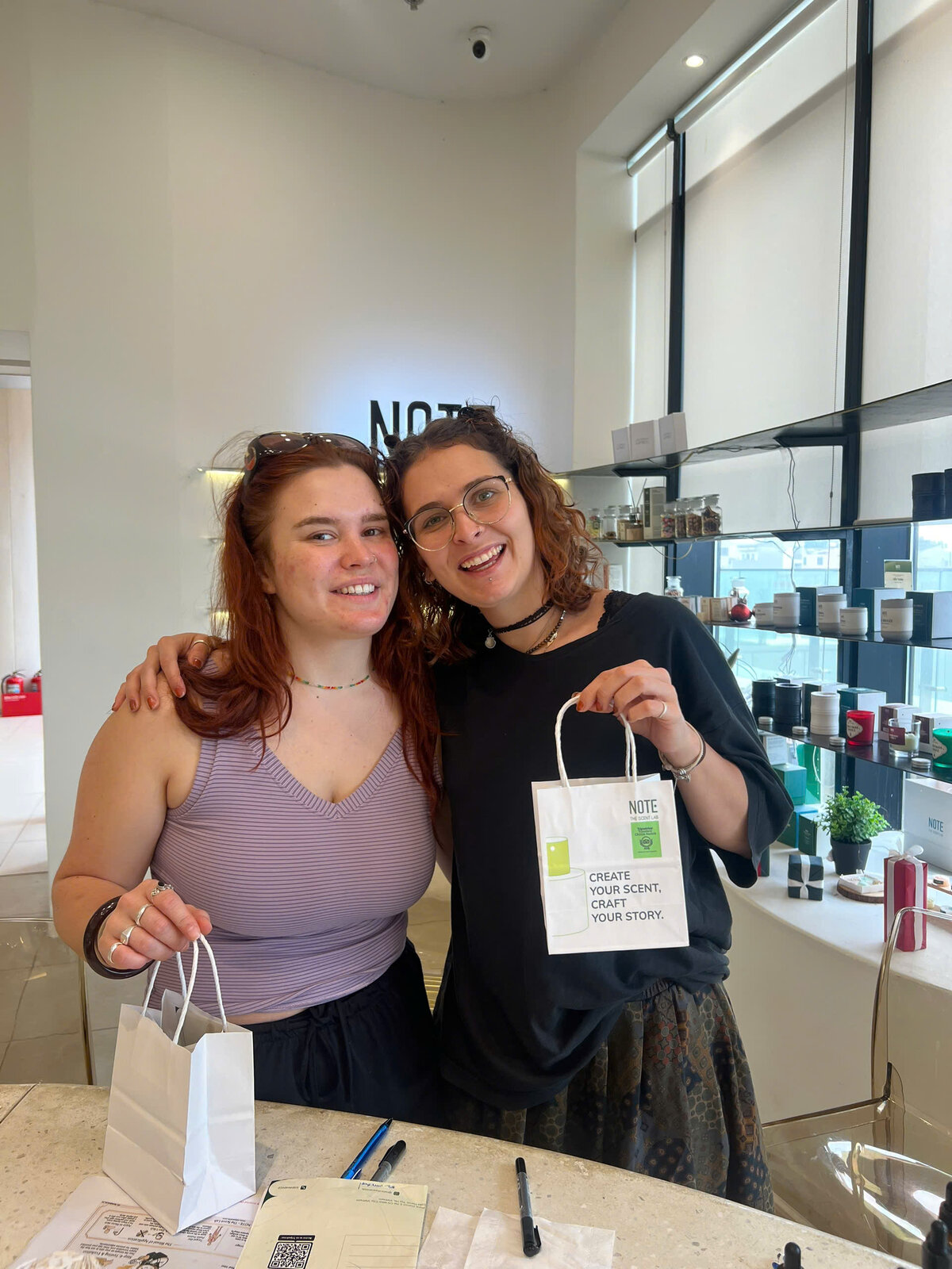 Friends with their custom finished perfumes at NOTE Lotte Mall West Lake Hanoi - the insider Tay Ho creative experience locals love