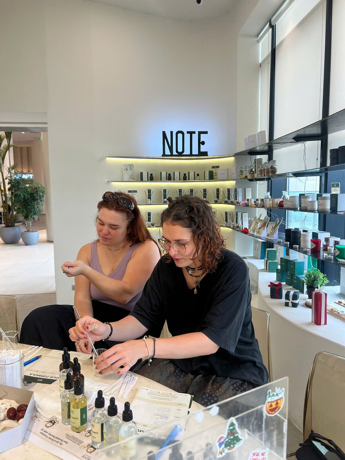 Inside NOTE The Scent Lab perfume workshop at Lotte Mall West Lake Hanoi - the bright airy interior travelers create custom scents in